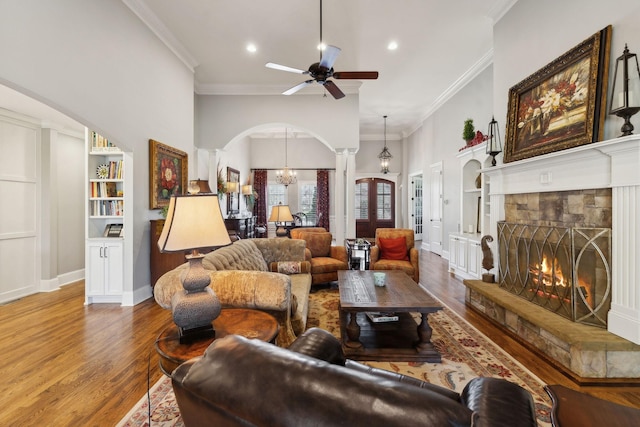 1194 Meadow Bridge Ln, Arrington, TN 37014 - living area with a ceiling fan, wood finished floors, arched walkways, ornamental molding, and ornate columns
