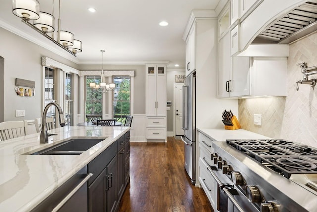 1194 Meadow Bridge Ln, Arrington, TN 37014 - kitchen with white cabinetry, custom range hood, a chandelier, a sink, and premium appliances
