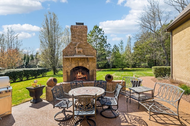 1194 Meadow Bridge Ln, Arrington, TN 37014 - view of patio with outdoor dining space and a warm lit fireplace