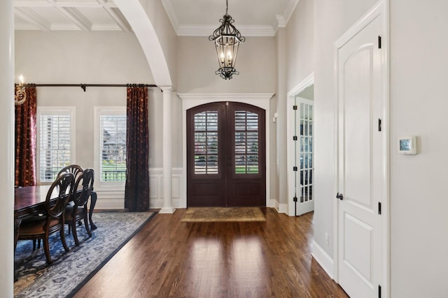 1194 Meadow Bridge Ln, Arrington, TN 37014 - foyer entrance with a healthy amount of sunlight, dark wood-style flooring, a notable chandelier, and arched walkways