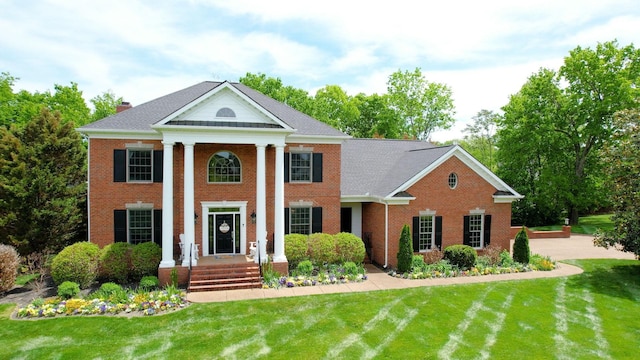 2145 Summer Hill Cir, Franklin, TN 37064 - greek revival inspired property with brick siding, a front lawn, and a chimney