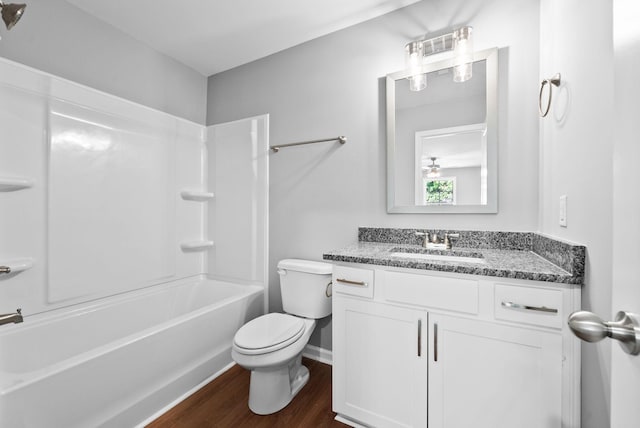837 Cumberland Dr, Clarksville, TN 37040 - bathroom featuring bathtub / shower combination, wood finished floors, vanity, baseboards, and toilet