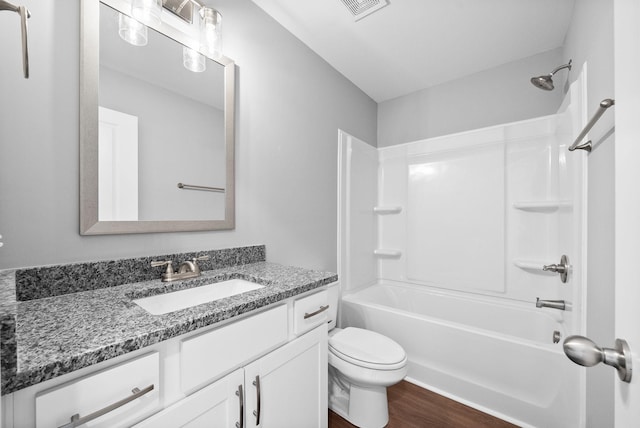 837 Cumberland Dr, Clarksville, TN 37040 - bathroom with visible vents, wood finished floors, vanity, toilet, and  shower combination