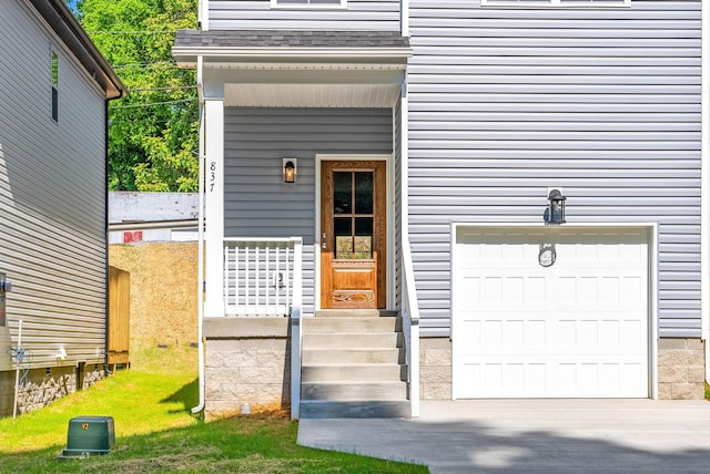 837 Cumberland Dr, Clarksville, TN 37040 - entrance to property with concrete driveway, an attached garage, and roof with shingles