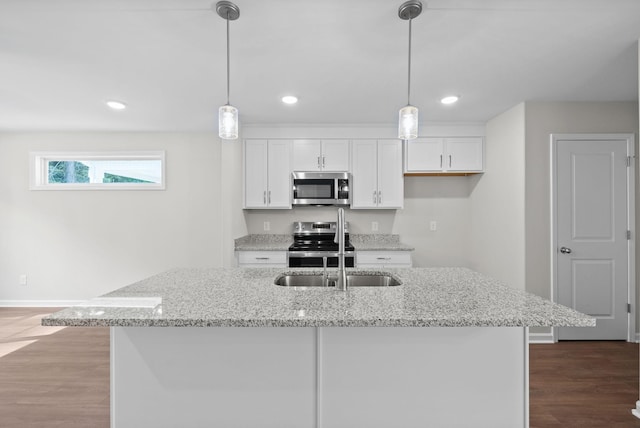 839 Cumberland Dr, Clarksville, TN 37040 - kitchen featuring appliances with stainless steel finishes, light stone countertops, white cabinetry, and wood finished floors