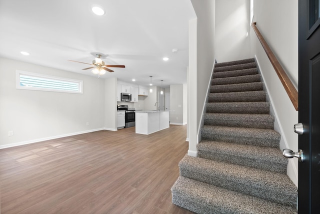 839 Cumberland Dr, Clarksville, TN 37040 - stairway featuring baseboards, recessed lighting, ceiling fan, and wood finished floors