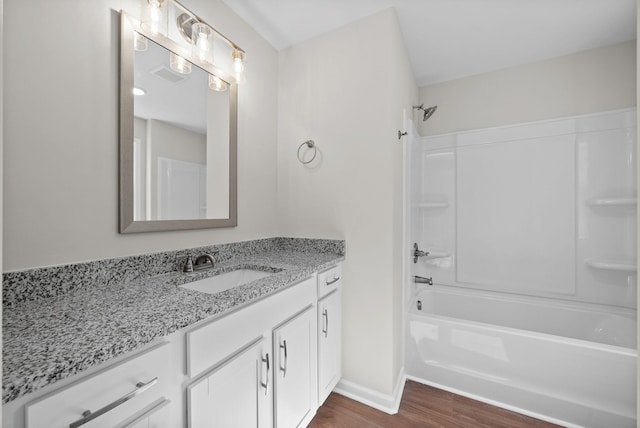 839 Cumberland Dr, Clarksville, TN 37040 - full bathroom with vanity, shower / bathing tub combination, baseboards, and wood finished floors