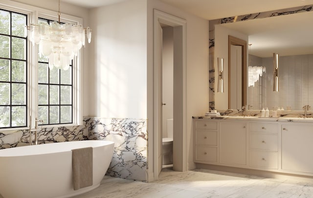 1352 Duncanwood Ct, Nashville, TN 37204 - full bath with marble finish floor, a freestanding bath, plenty of natural light, and a chandelier