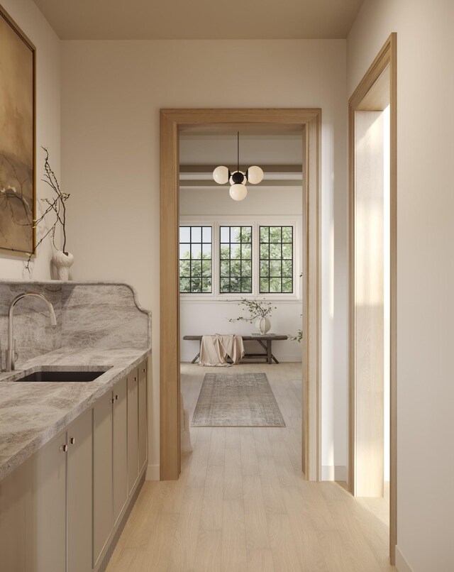 1352 Duncanwood Ct, Nashville, TN 37204 - kitchen with light wood finished floors, light stone countertops, and a sink