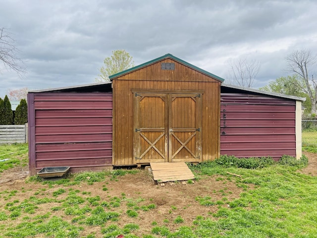 view of shed with fence