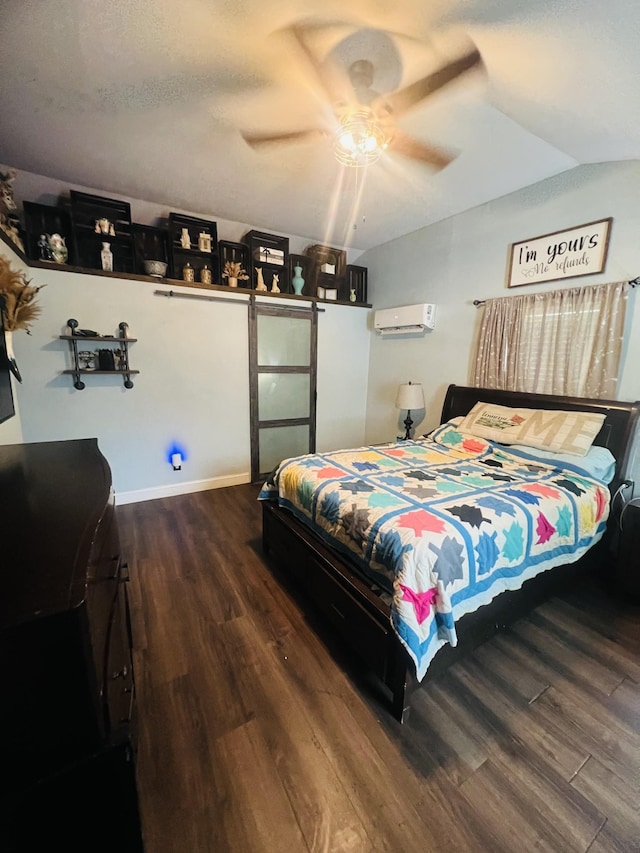 bedroom featuring an AC wall unit, ceiling fan, and wood finished floors