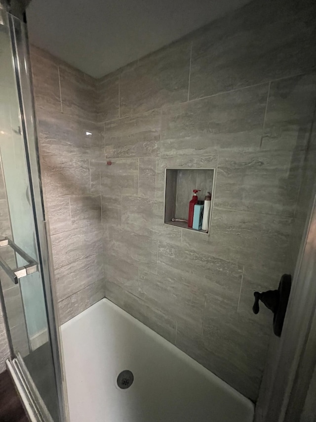 full bathroom with a shower stall