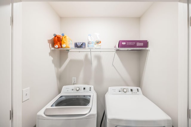 laundry area featuring washer and dryer and laundry area