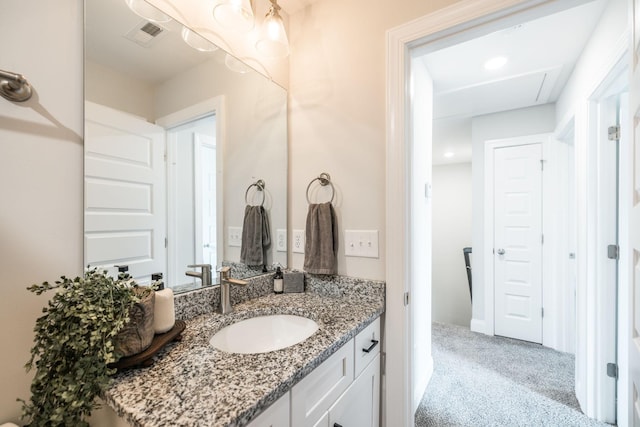 bathroom featuring vanity and visible vents