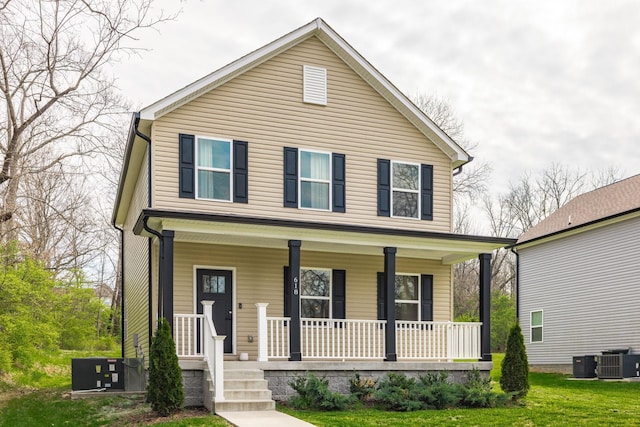 view of front of home with cooling unit and a porch