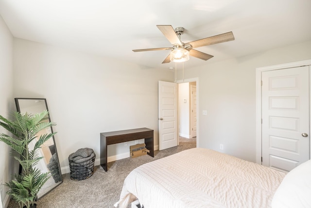 bedroom with a ceiling fan, carpet floors, and baseboards
