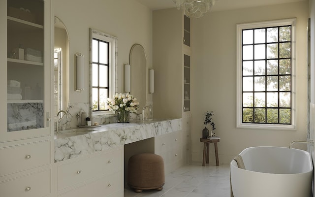 1117 Granny White Ct, Nashville, TN 37204 - full bath featuring marble finish floor, a freestanding bath, a notable chandelier, and vanity