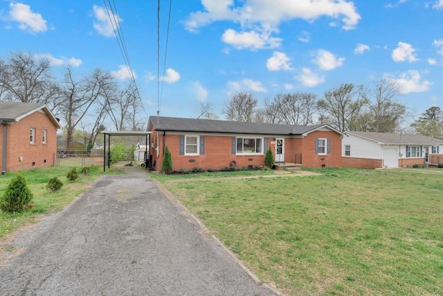 ranch-style home featuring a front lawn, crawl space, a carport, and brick siding