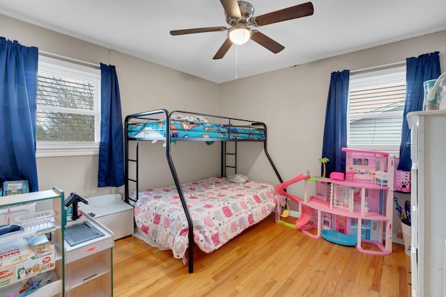 bedroom with ceiling fan and wood finished floors