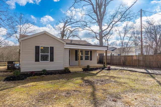 view of front of property with fence and a porch