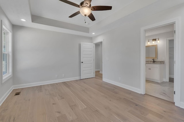 unfurnished bedroom featuring recessed lighting, visible vents, baseboards, and light wood-style flooring