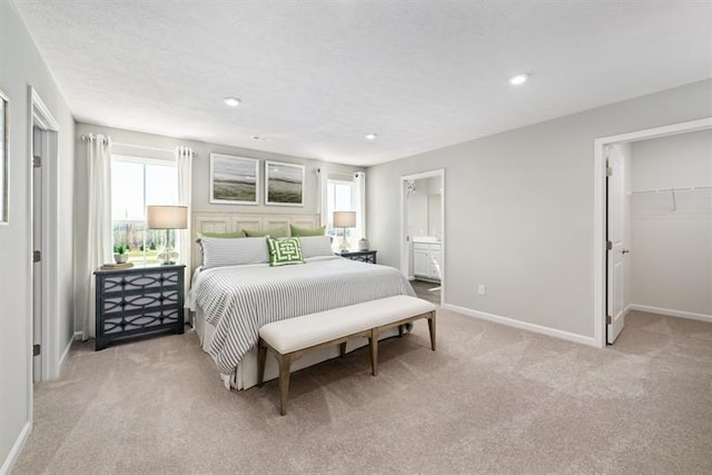 1169 Savannah Ave, Gallatin, TN 37066 - bedroom featuring light carpet, multiple windows, baseboards, recessed lighting, and a spacious closet