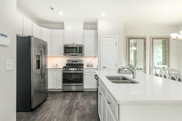 1169 Savannah Ave, Gallatin, TN 37066 - kitchen featuring stainless steel appliances, a sink, dark wood-style flooring, white cabinetry, and recessed lighting
