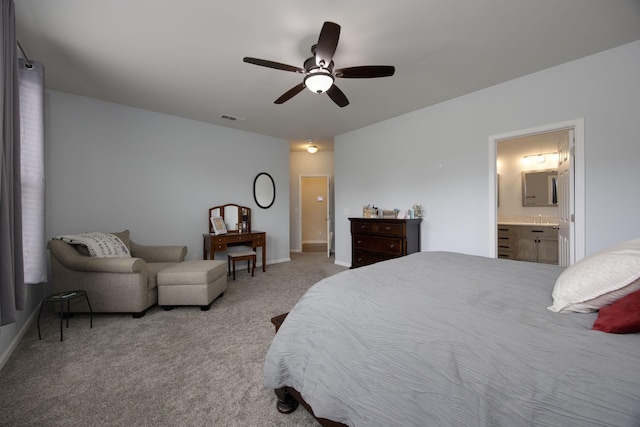bedroom featuring ensuite bathroom, ceiling fan, carpet, and visible vents
