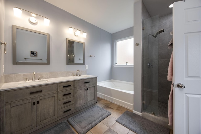 bathroom with a sink, a bath, double vanity, and a stall shower