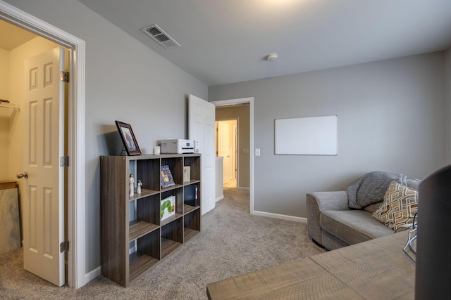sitting room featuring visible vents, baseboards, and carpet