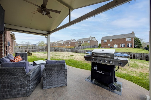 view of patio featuring an outdoor living space, ceiling fan, a grill, a fenced backyard, and a residential view