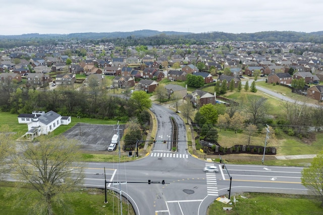 birds eye view of property with a residential view