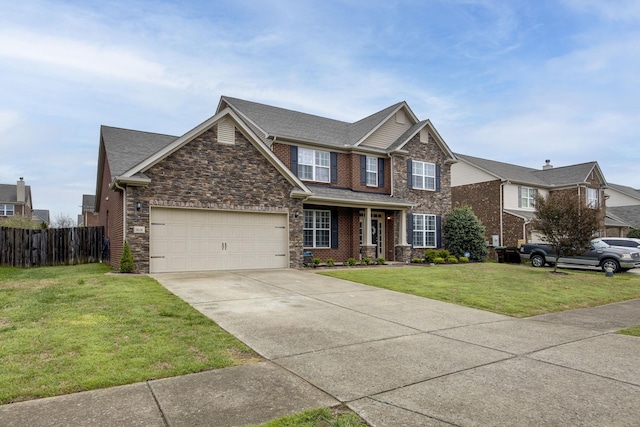 craftsman house featuring stone siding, fence, a front lawn, an attached garage, and concrete driveway