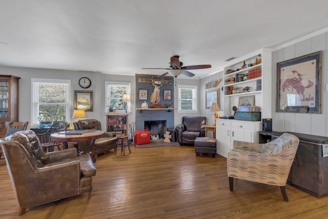 4337 Morriswood Dr, Nashville, TN 37204 - living room featuring wood finished floors, ceiling fan, crown molding, and a brick fireplace