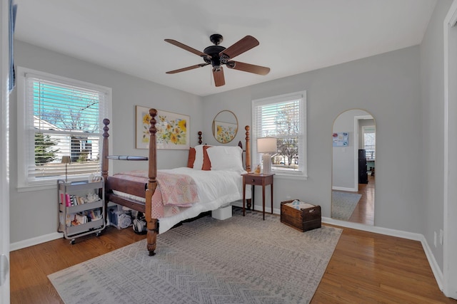 4337 Morriswood Dr, Nashville, TN 37204 - bedroom with arched walkways, baseboards, wood finished floors, and ceiling fan