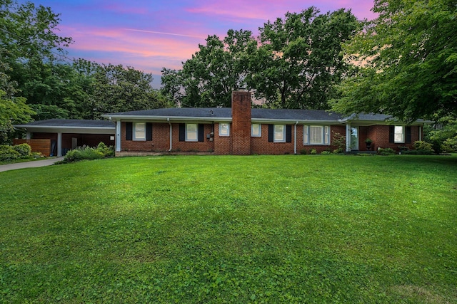 4337 Morriswood Dr, Nashville, TN 37204 - ranch-style house featuring a chimney, a yard, a carport, brick siding, and concrete driveway