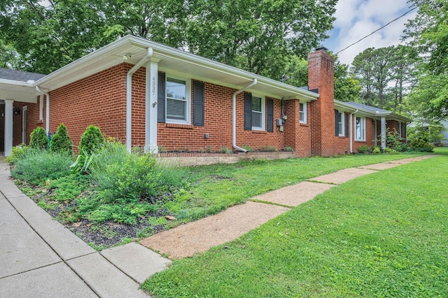 4337 Morriswood Dr, Nashville, TN 37204 - view of front of home featuring a chimney, a front yard, and brick siding