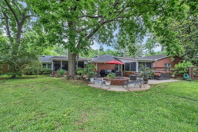 4337 Morriswood Dr, Nashville, TN 37204 - back of house with a sunroom, a patio area, and brick siding