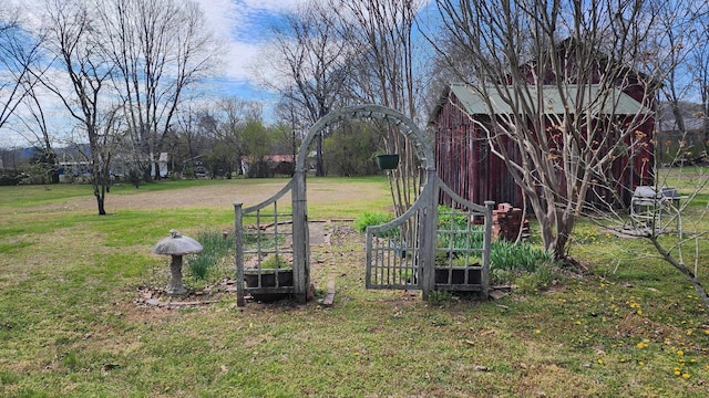 1385 Mitchell St, Celina, TN 38551 - view of yard featuring an outdoor structure, a vegetable garden, and a barn
