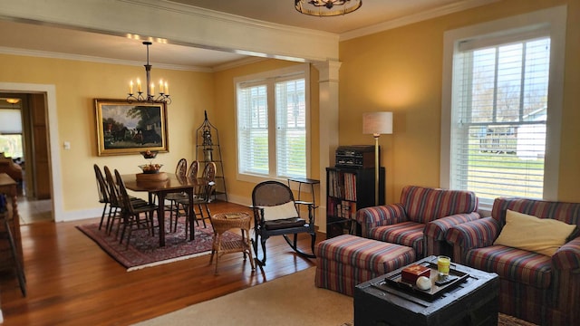 1385 Mitchell St, Celina, TN 38551 - living room with a notable chandelier, crown molding, baseboards, and wood finished floors