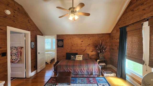1385 Mitchell St, Celina, TN 38551 - bedroom with wooden walls, vaulted ceiling, and wood finished floors
