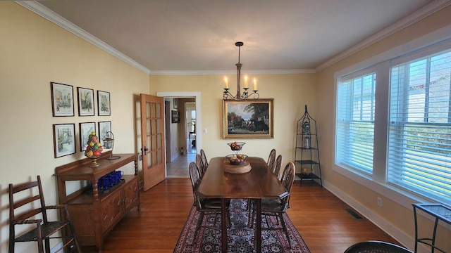 1385 Mitchell St, Celina, TN 38551 - dining area with baseboards, dark wood-style floors, an inviting chandelier, and ornamental molding
