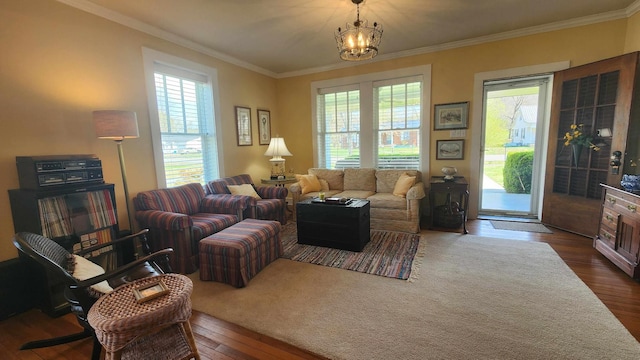 1385 Mitchell St, Celina, TN 38551 - living area with dark wood-style flooring, ornamental molding, a notable chandelier, and a wealth of natural light