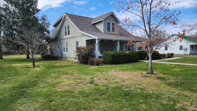1385 Mitchell St, Celina, TN 38551 - view of front of property with a front lawn and a shingled roof