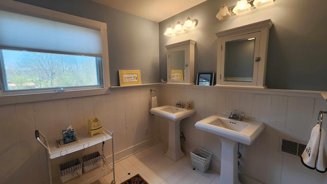 1385 Mitchell St, Celina, TN 38551 - bathroom featuring a wainscoted wall, tile patterned floors, and visible vents