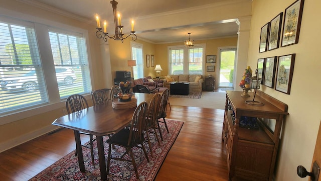 1385 Mitchell St, Celina, TN 38551 - dining room with baseboards, a notable chandelier, crown molding, and wood finished floors