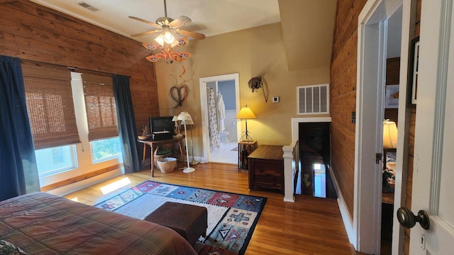 1385 Mitchell St, Celina, TN 38551 - bedroom with wood finished floors, wood walls, baseboards, and visible vents