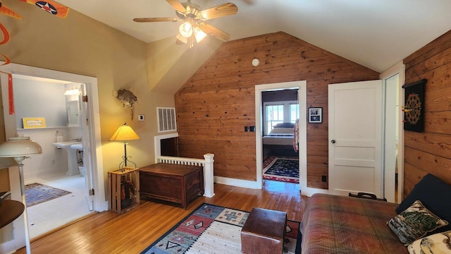1385 Mitchell St, Celina, TN 38551 - bedroom featuring visible vents, wooden walls, vaulted ceiling, and wood finished floors