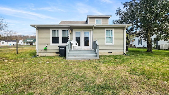 1385 Mitchell St, Celina, TN 38551 - back of house with french doors, crawl space, cooling unit, and a lawn