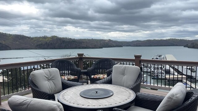 764 Cedar Hill Rd, Celina, TN 38551 - wooden deck featuring outdoor lounge area, outdoor dining space, and a water view